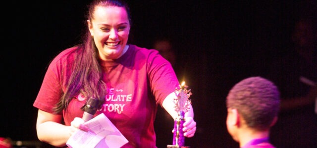 Leanne from FTM Dance gives a young person an award