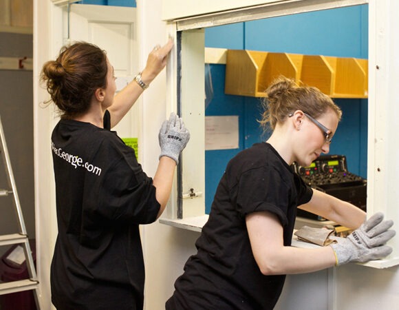 Volunteers from George at ASDA helping redecorate a school in Leicester
