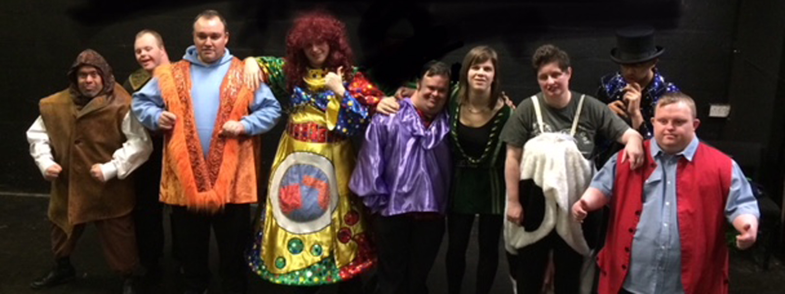 People with learning disabilities performing on stage in a pantomime